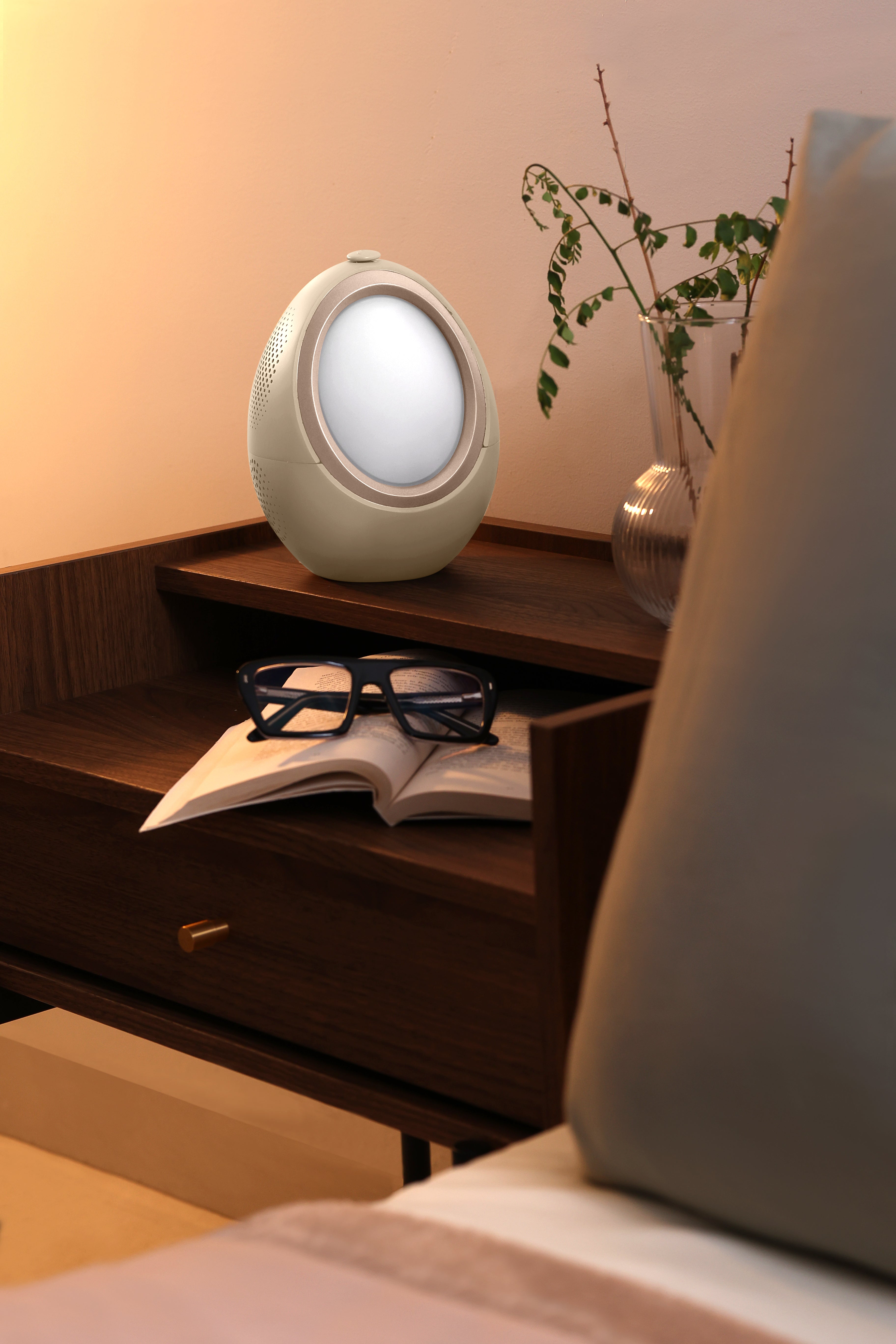 AI sleep companion by Naptick on bedside table creating a relaxing sleep environment